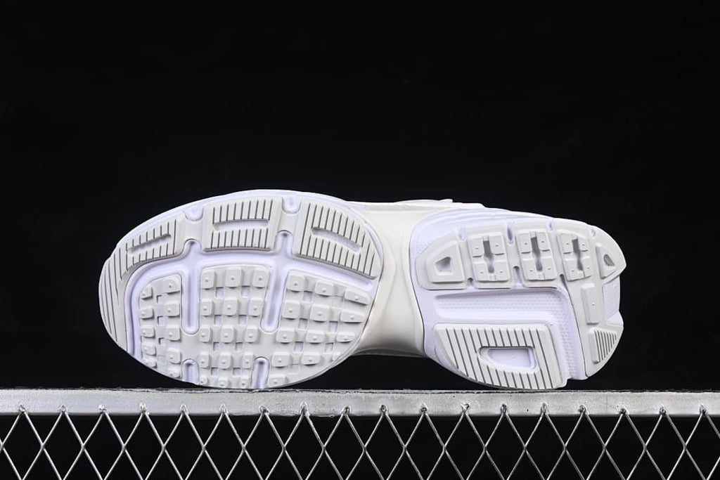Underside view showing the patterned sneaker outsoles