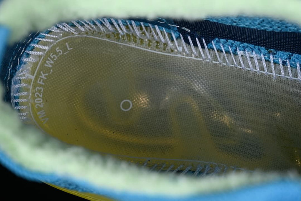 Close-up inside the shoe showing the insole and knit lining.
