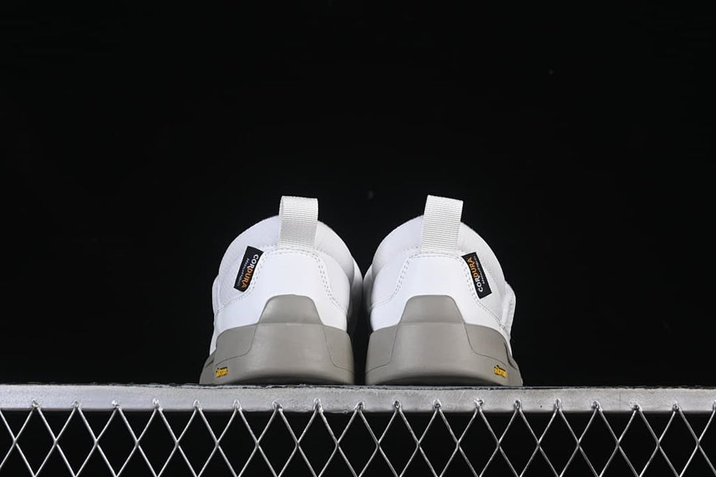 Rear view of the pair showing heel tabs and grey outsoles