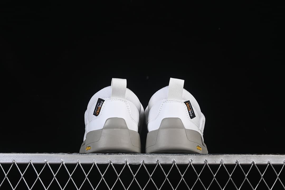 Rear view of the pair showing heel tabs and grey outsoles