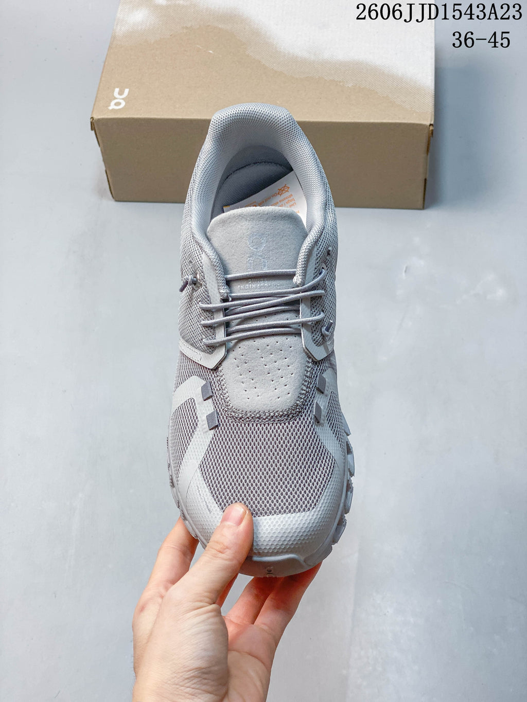Top view of the grey sneaker showing its lace-up closure and upper.