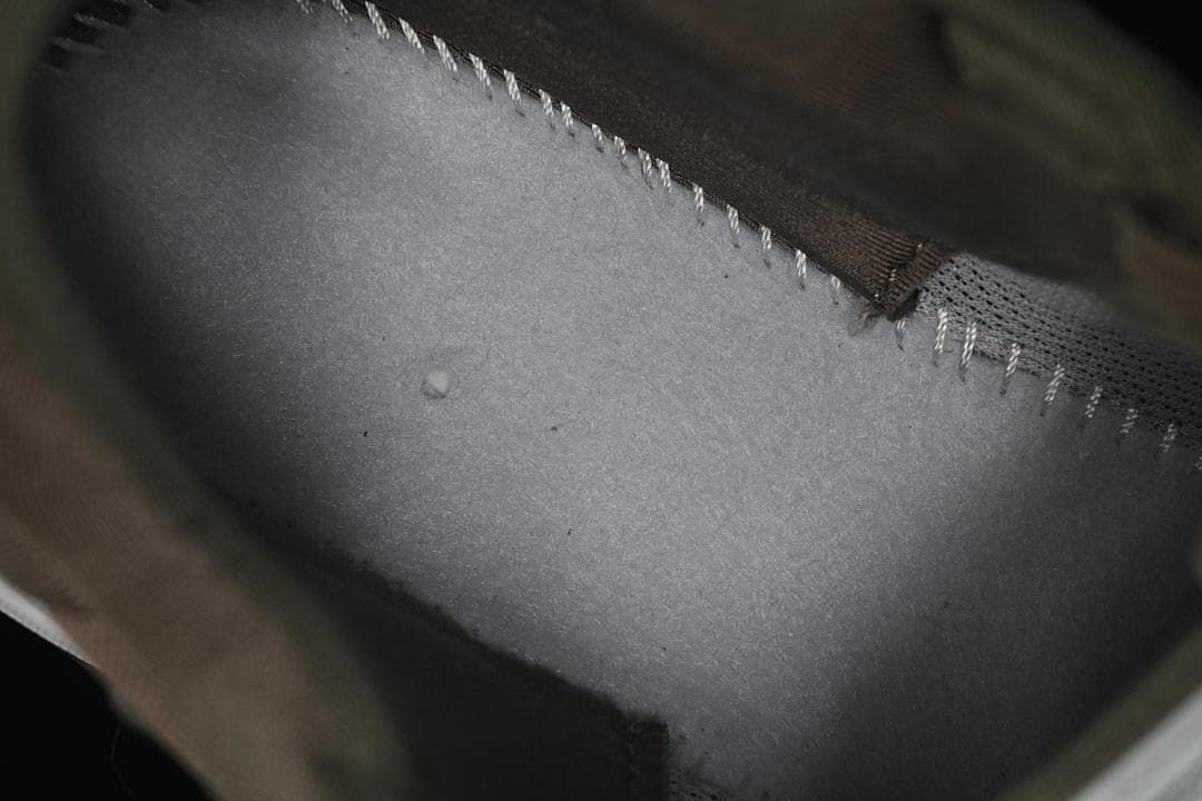 Interior close-up showing stitching and the padded lining