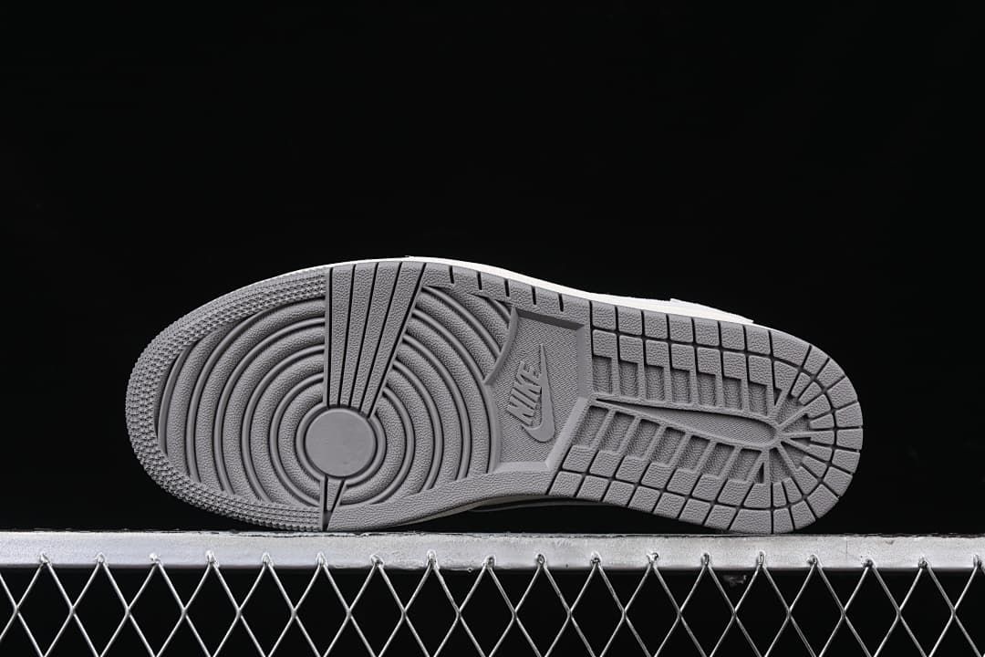Underside view showing the gray tread pattern