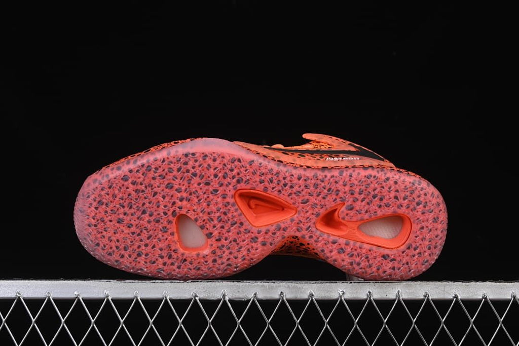 Underside view of the translucent-looking outsole with cutout details.