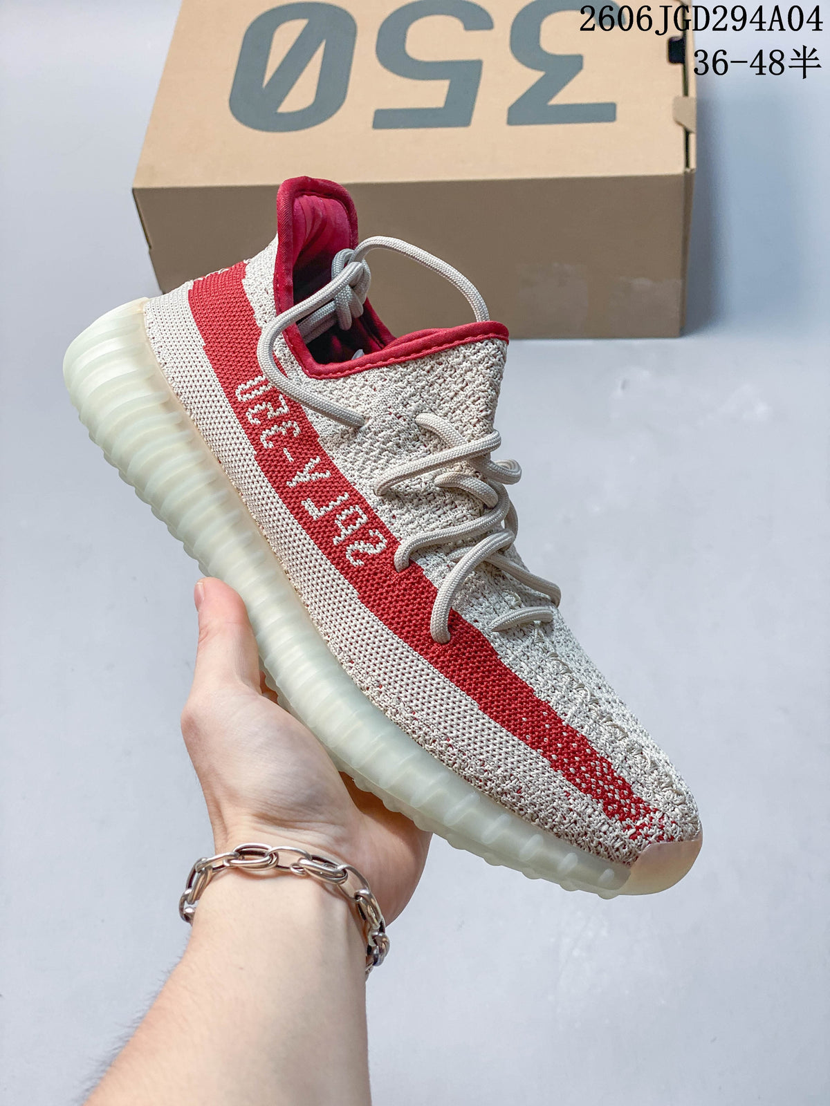 Blue, black, gray, and red knit-look low-top sneaker with a contrasting red side stripe and translucent-looking sole.