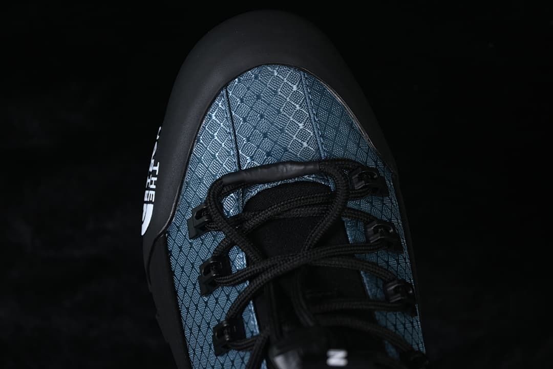 Top view of the patterned toe area and lace-up closure.