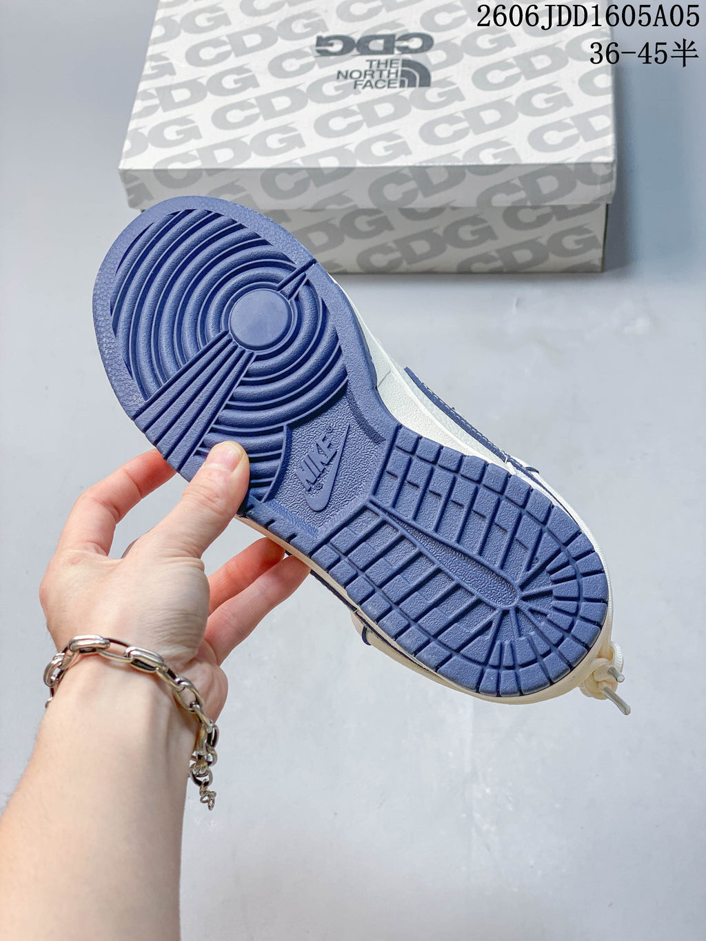 Close-up of the navy-colored outsole on a Nike SB Dunk Low sneaker.