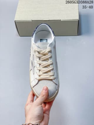 Top view of a white and gray lace-up sneaker