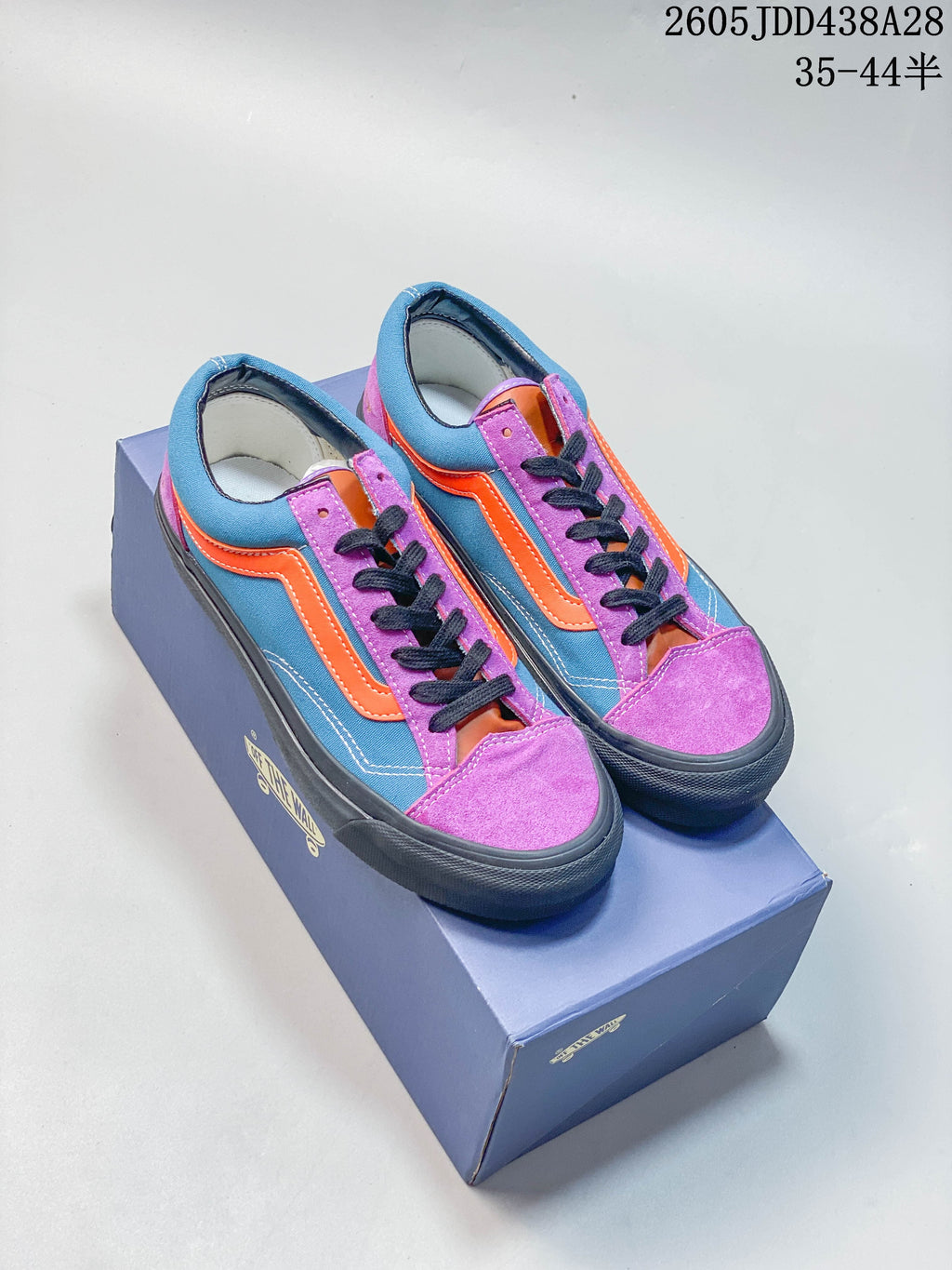 Pair of blue, purple, and orange Vans OTW Old Skool 36 sneakers on a shoe box