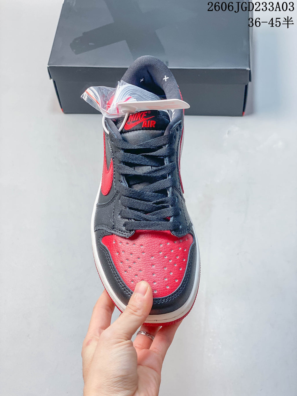 Front view showing the perforated red toe and dark laces