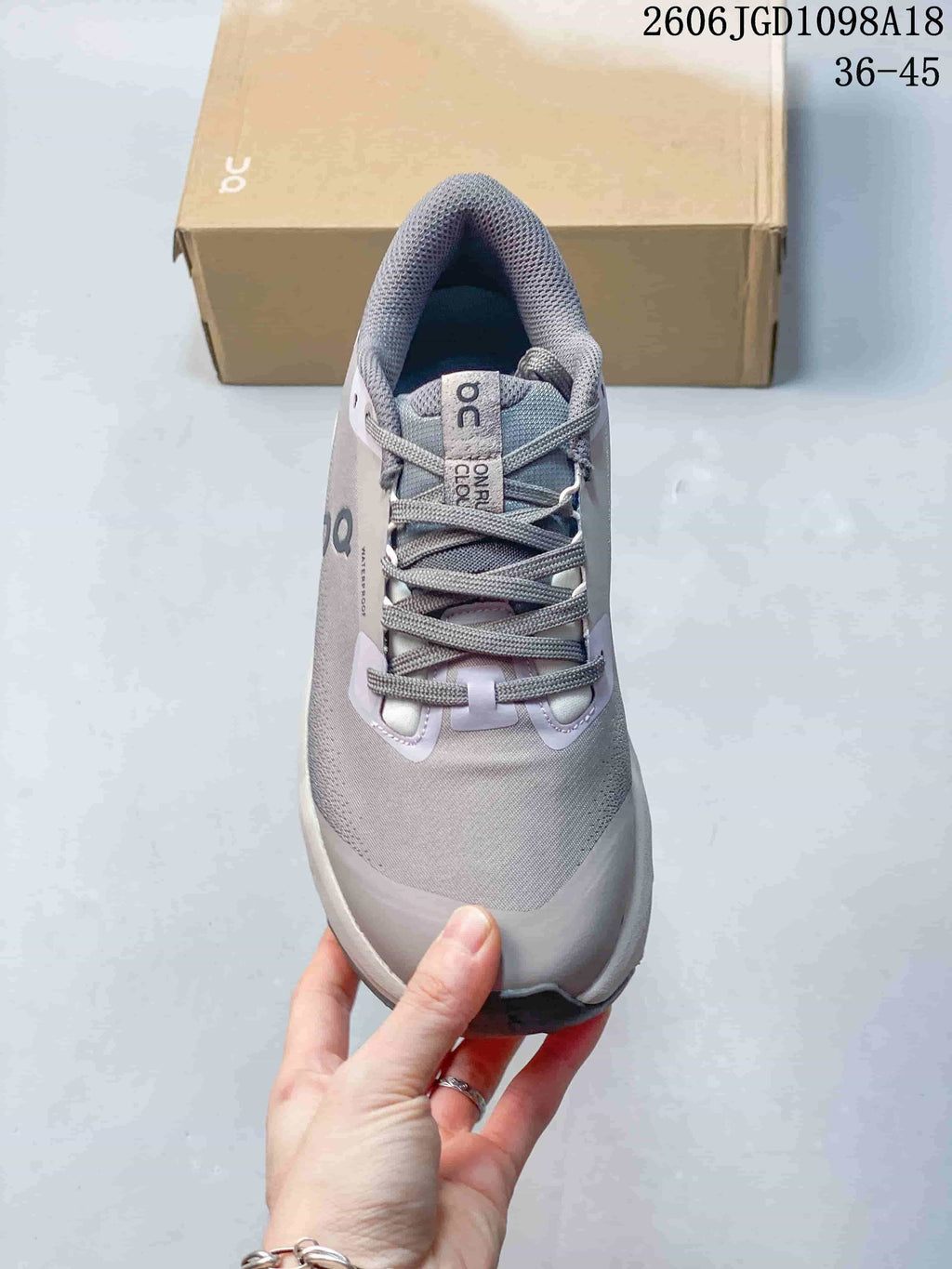 Top view of a Cloudmonster 3 sneaker showing its laces, tongue, and toe
