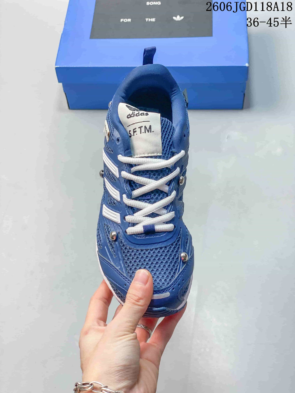Top-down view of the blue mesh-look sneaker with white laces.