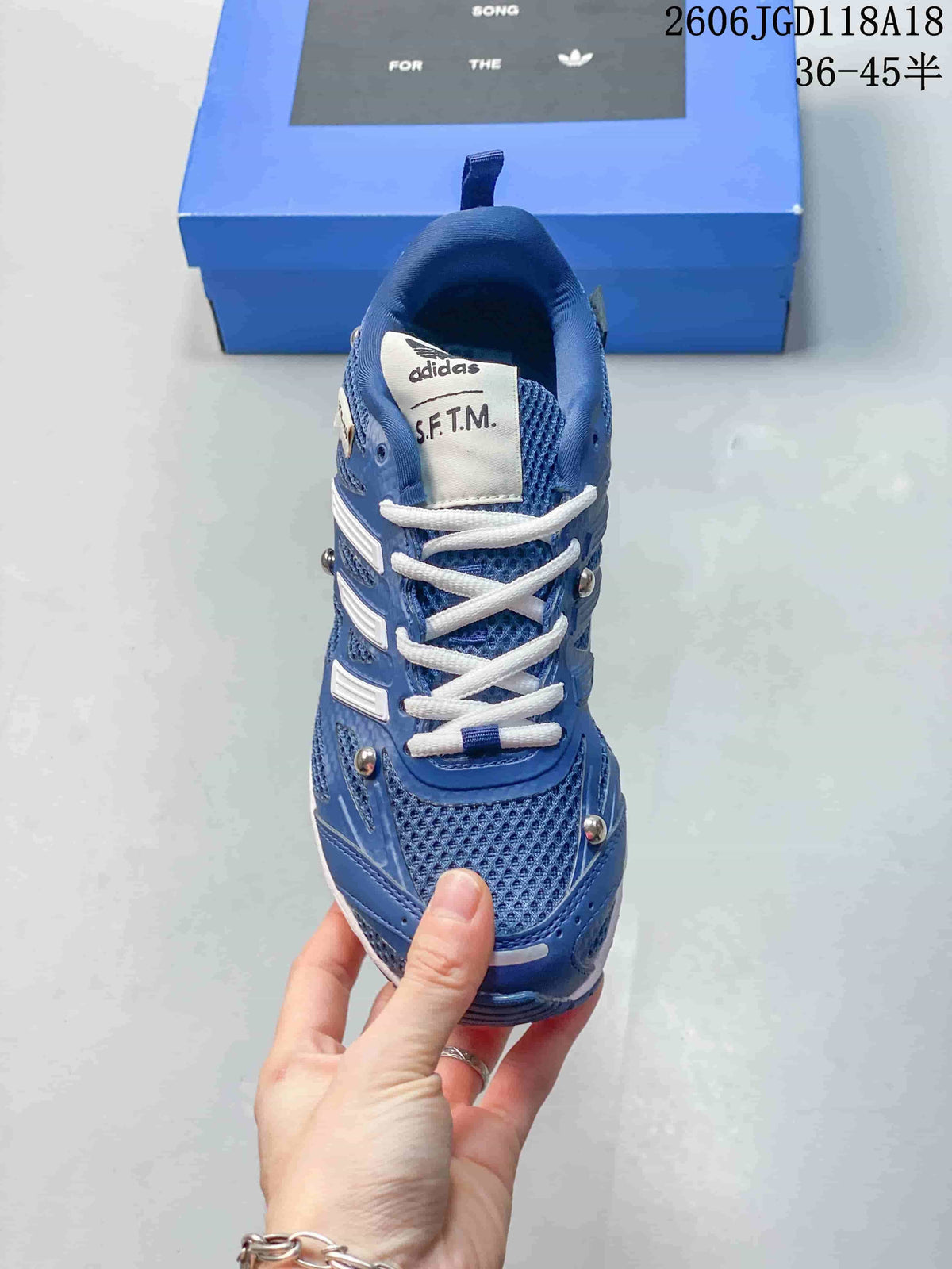 Top-down view of the blue mesh-look sneaker with white laces.