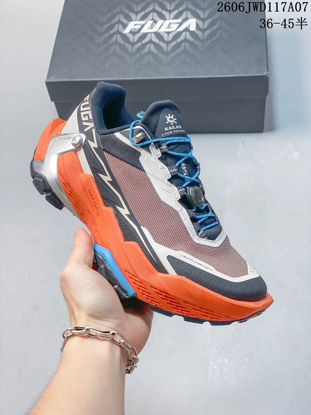 KAILAS FUGA DU 2 trail shoe in a gray and orange colorway with blue laces