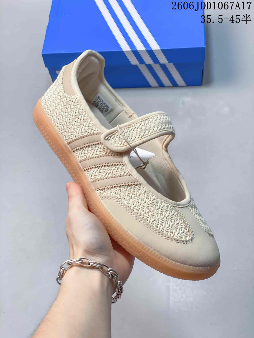 Angled view of a cream Mary Jane sneaker with a textured upper and gum-colored sole