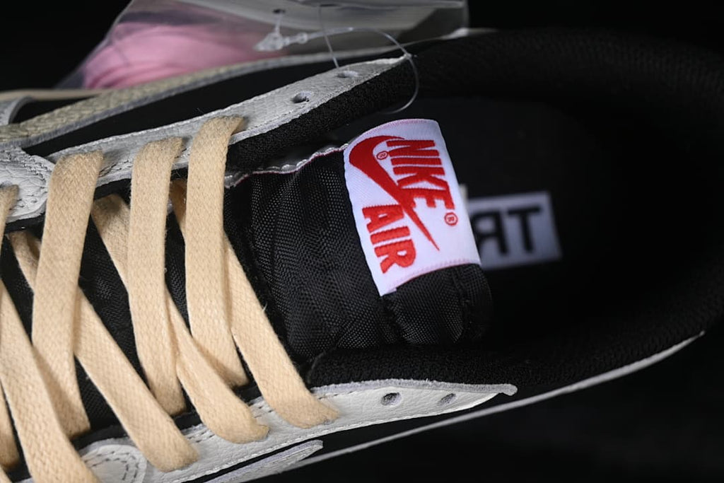 Close-up of the tongue label, black tongue, and cream laces.