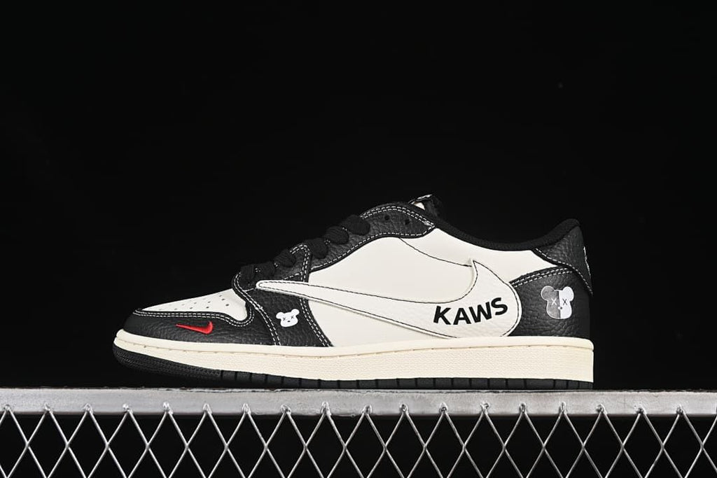 Side view of a black-and-white low-top sneaker with graphic details and a cream-colored midsole