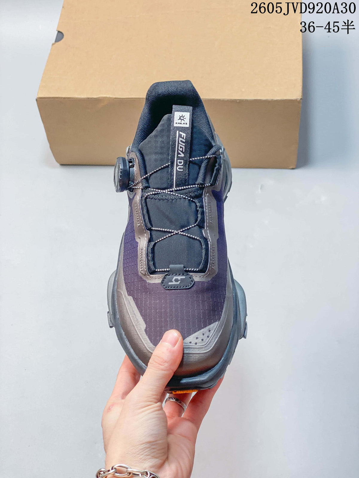 Top view of the shoe showing its tongue, lace routing, and rotary closure.