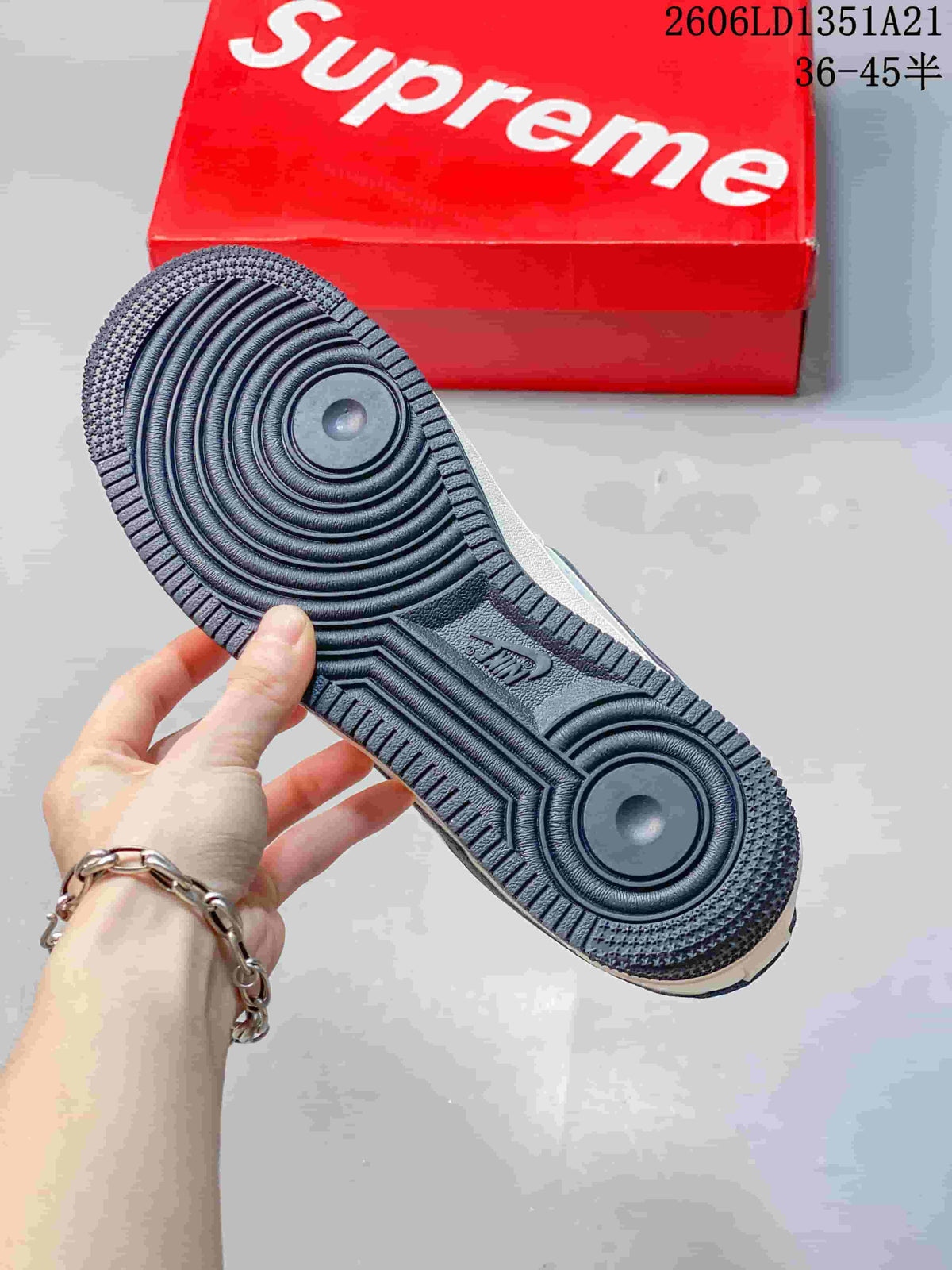 Close view of the dark patterned outsole and circular tread design.