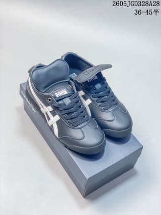 Pair of navy Onitsuka Tiger MEXICO 66 GOLF sneakers displayed on a shoe box