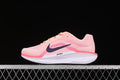 Side view of pink Nike Winflo 11 running shoe with dark Swoosh and light midsole.