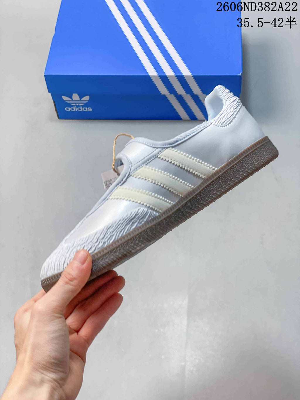 Side profile of an Adidas Samba Jane sneaker with three stripes and a gum-look outsole.