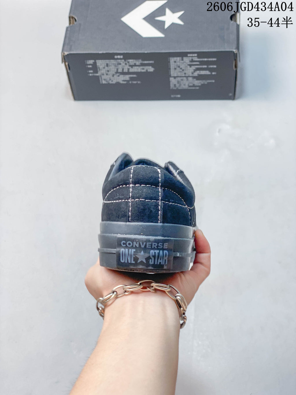 Rear view of the dark blue Converse One Star Pro heel.