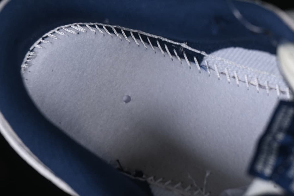 Close-up of the shoe's inner construction and stitching.