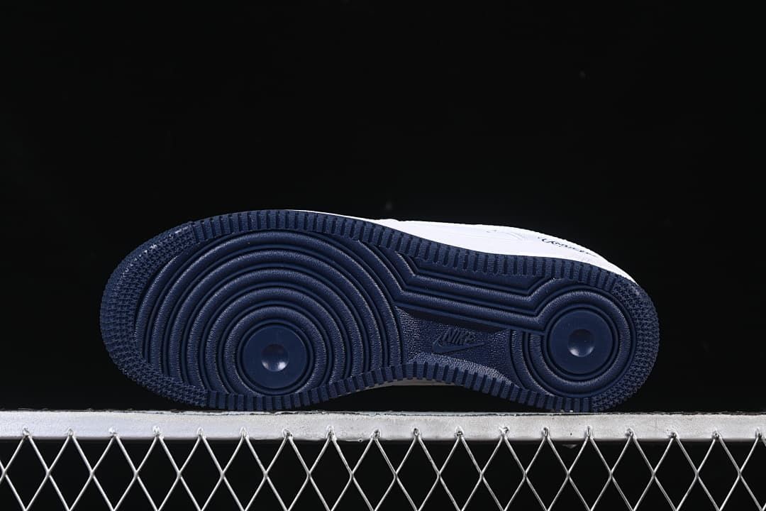 Underside view showing the navy circular outsole tread