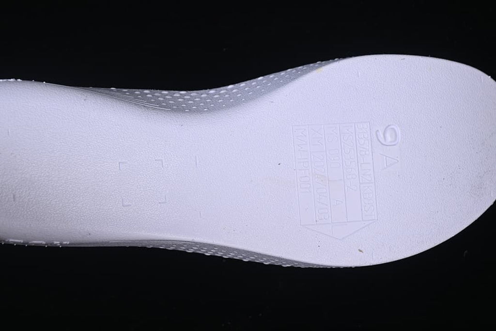 Close-up of embossed size and production markings on an insole