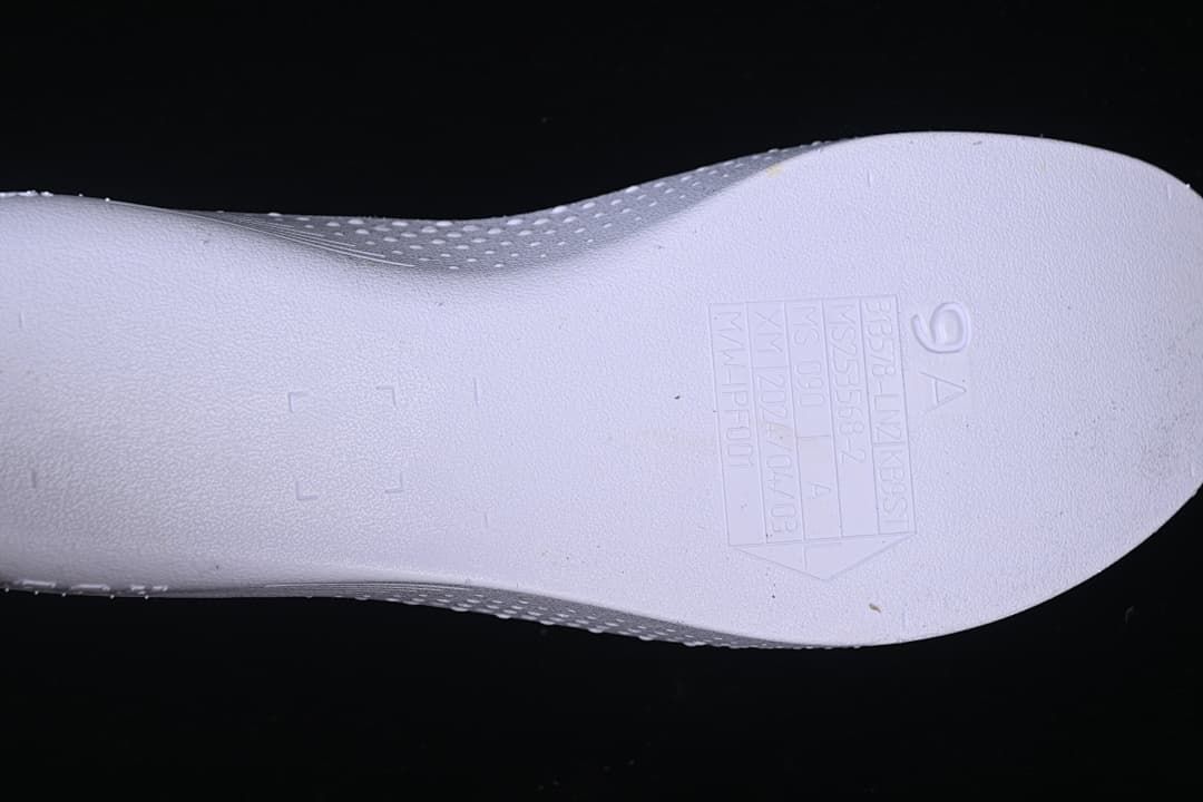 Close-up of embossed size and production markings on an insole