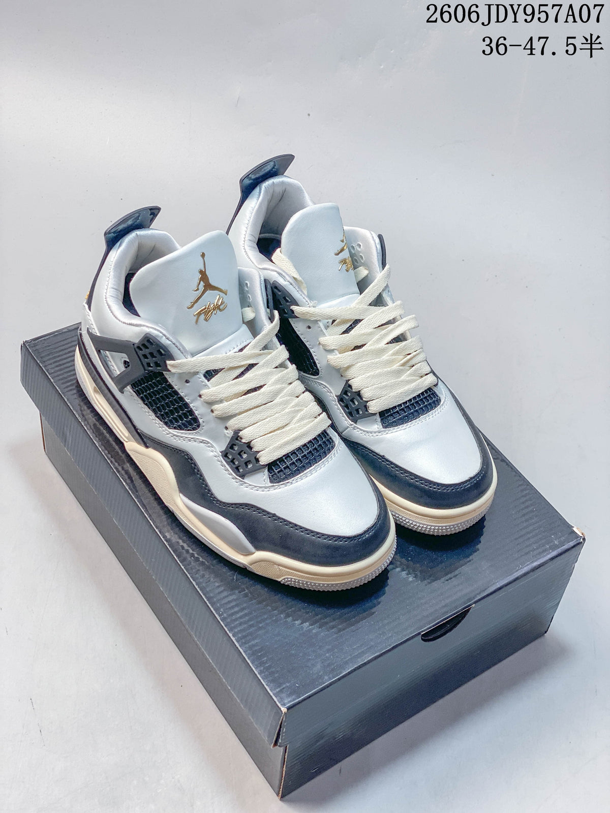 Pair of white and dark-panel Jordan 4 sneakers shown on a shoe box