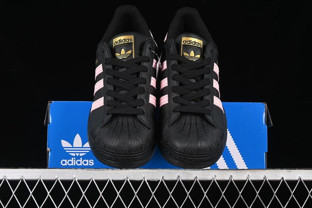 Front view of the pair showing black laces and textured toe fronts