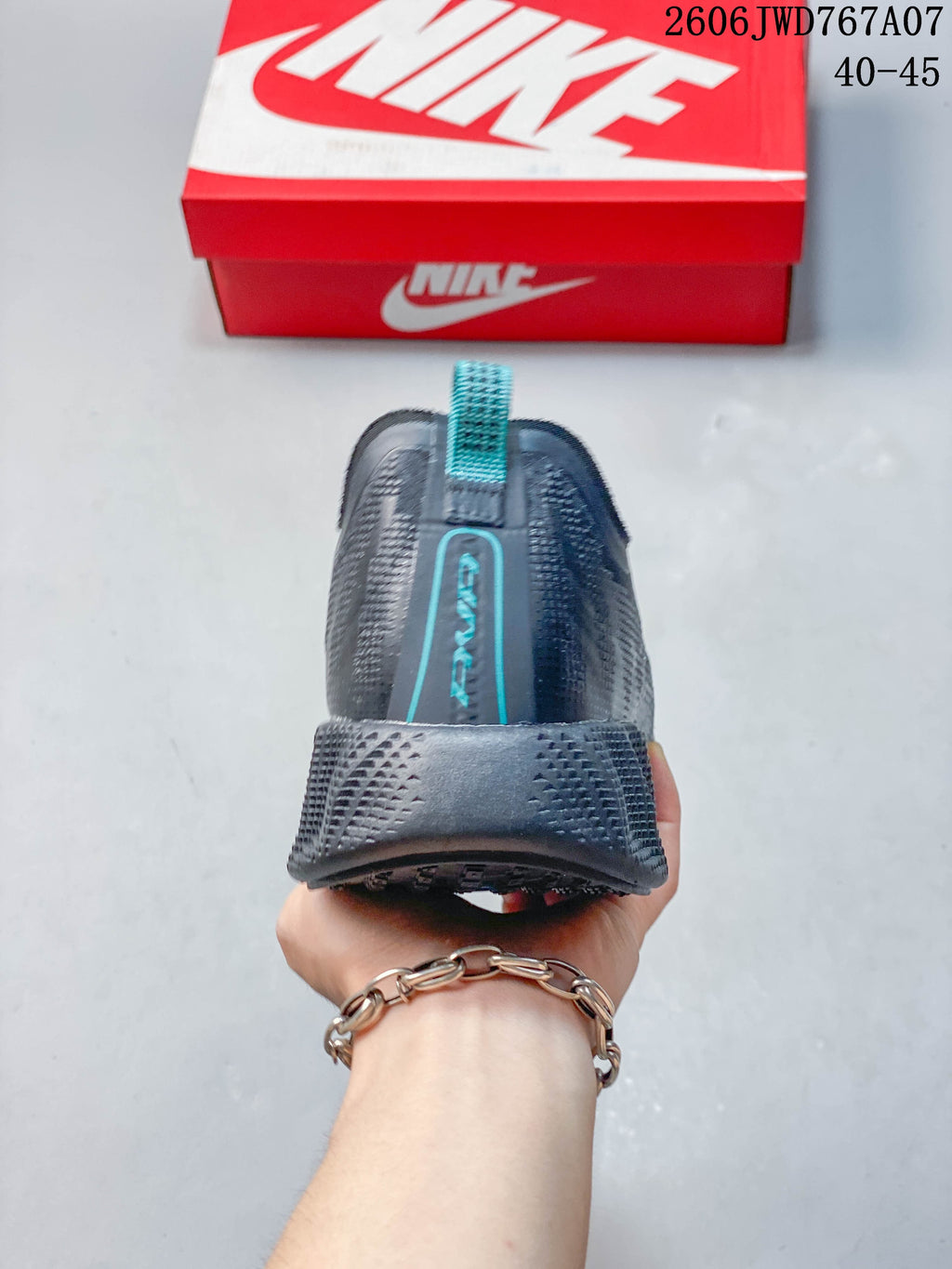Rear view showing the heel and teal pull tab
