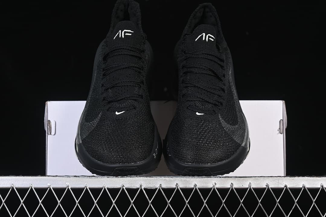 Front view of the pair of black running shoes