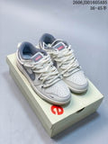 Pair of off-white and grey low-top sneakers shown on a box