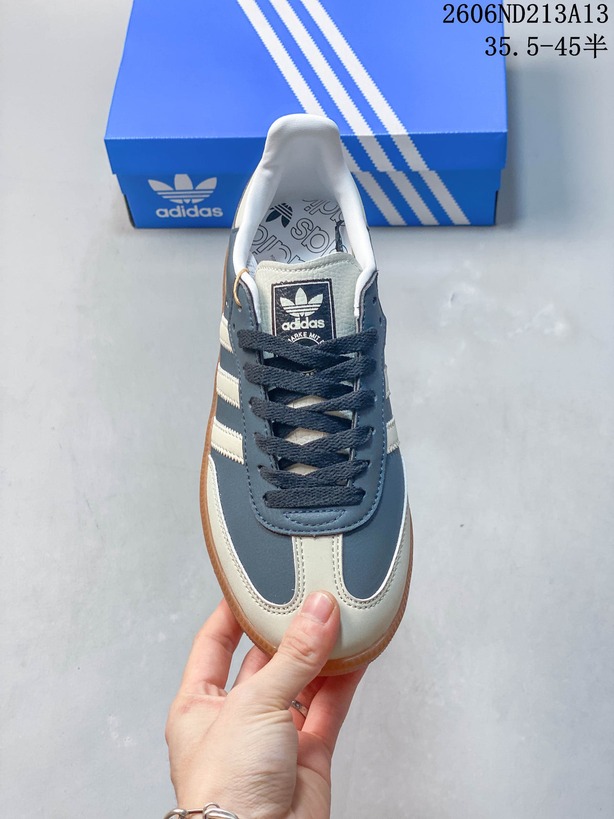 Front view of the adidas Samba OG sneaker with cream panels and dark laces