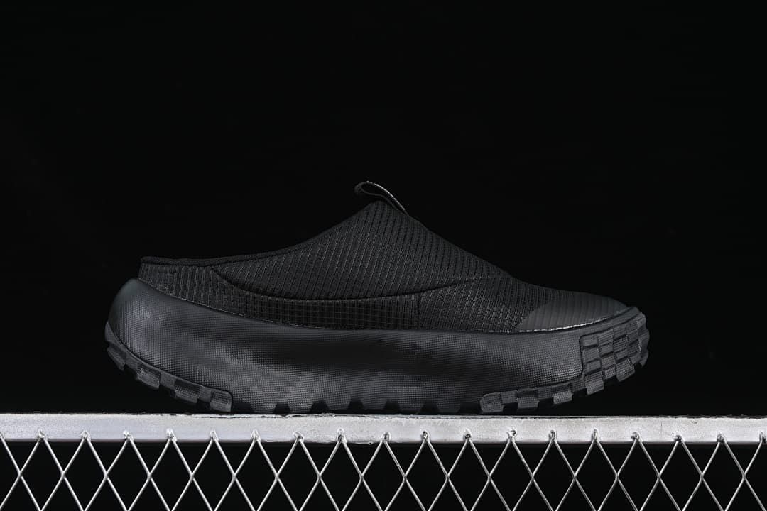 Side profile of the black mule and chunky outsole
