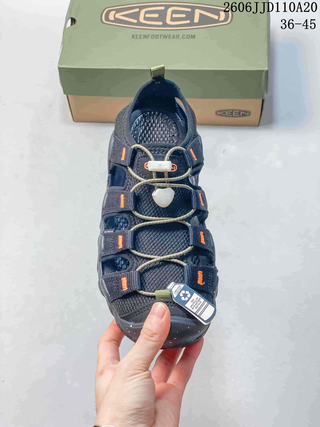 Top view showing the sandal's open sections, cord-and-toggle closure, and protective toe.