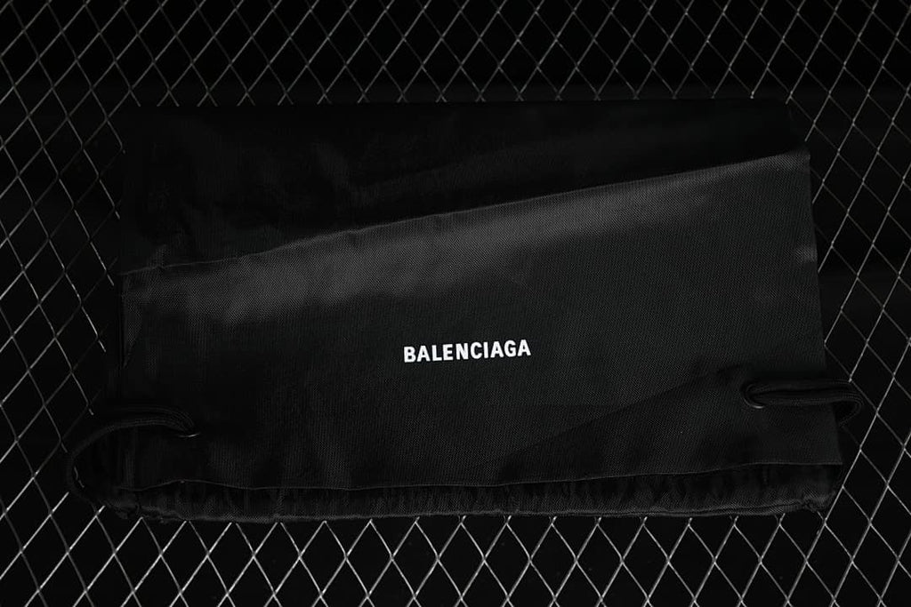 Black drawstring shoe bag marked Balenciaga