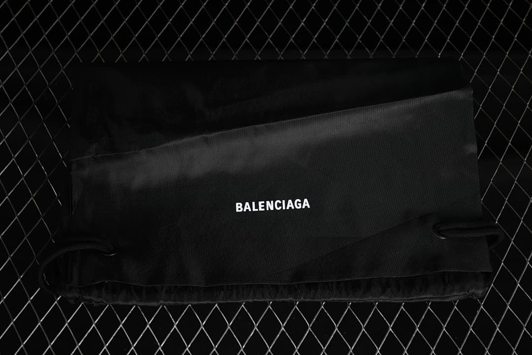 Black drawstring shoe bag marked Balenciaga
