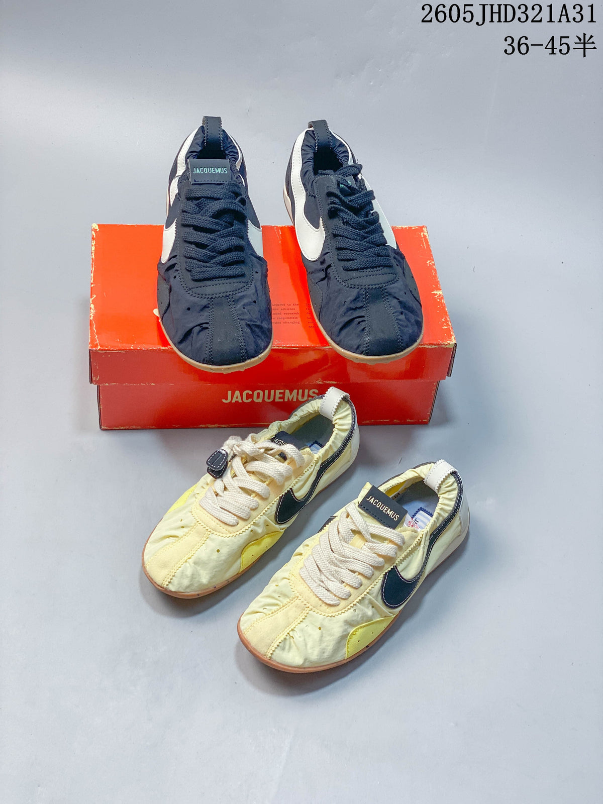 Navy and pale yellow Nike Jacquemus Moon Shoe SP sneakers shown together.