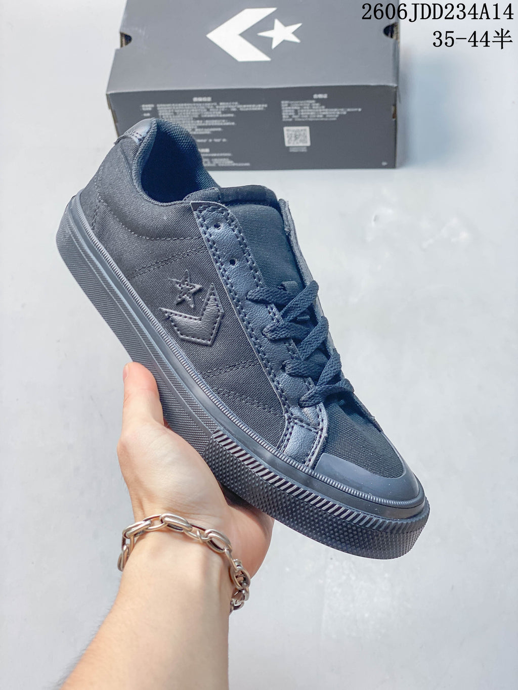 Charcoal Converse Sport Casual low-top sneaker with matching dark laces and sole
