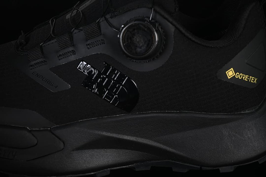Close-up of the side branding, dial closure, and GORE-TEX marking.