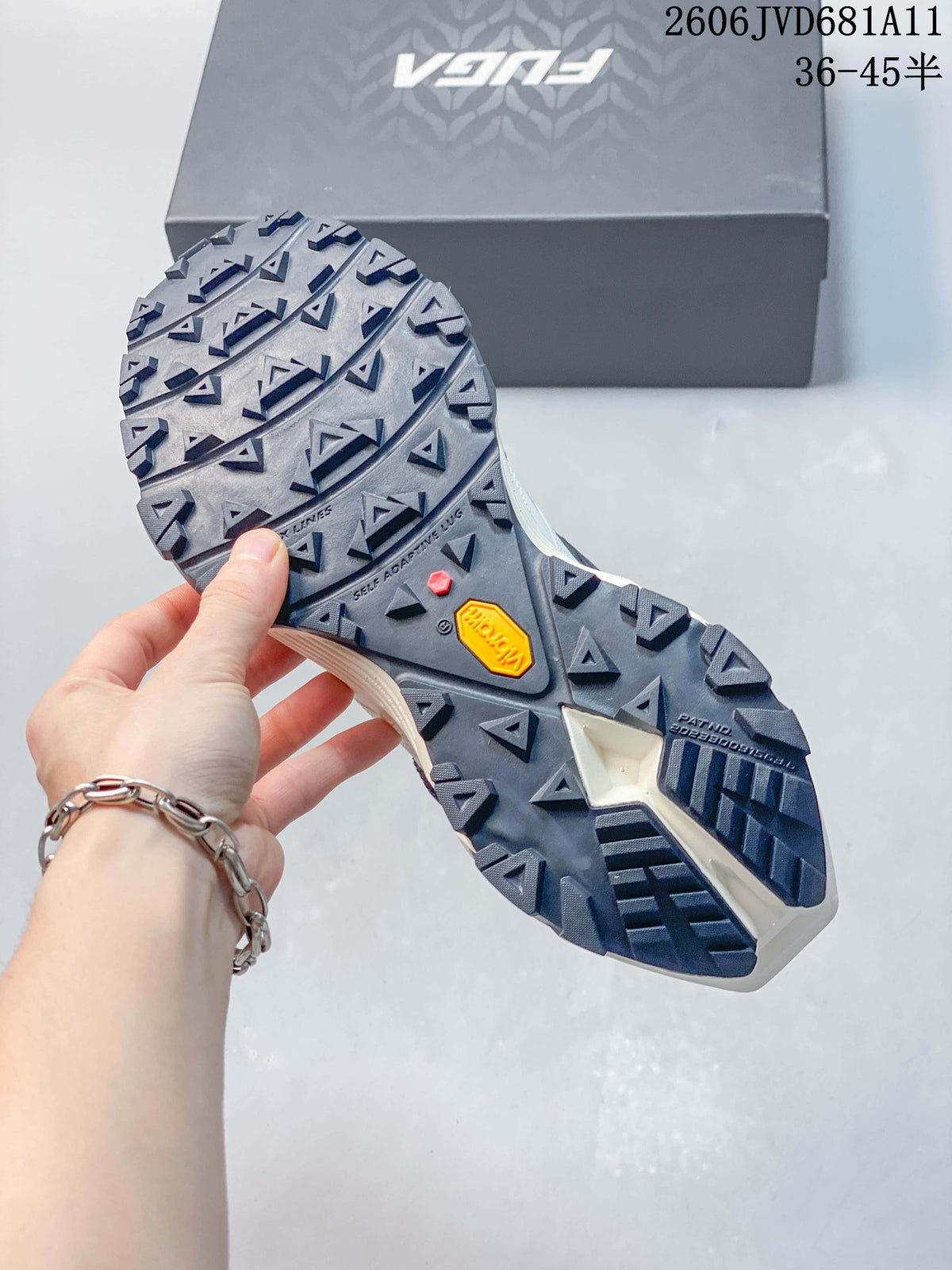 Close-up of the shoe outsole showing deep angular lugs.