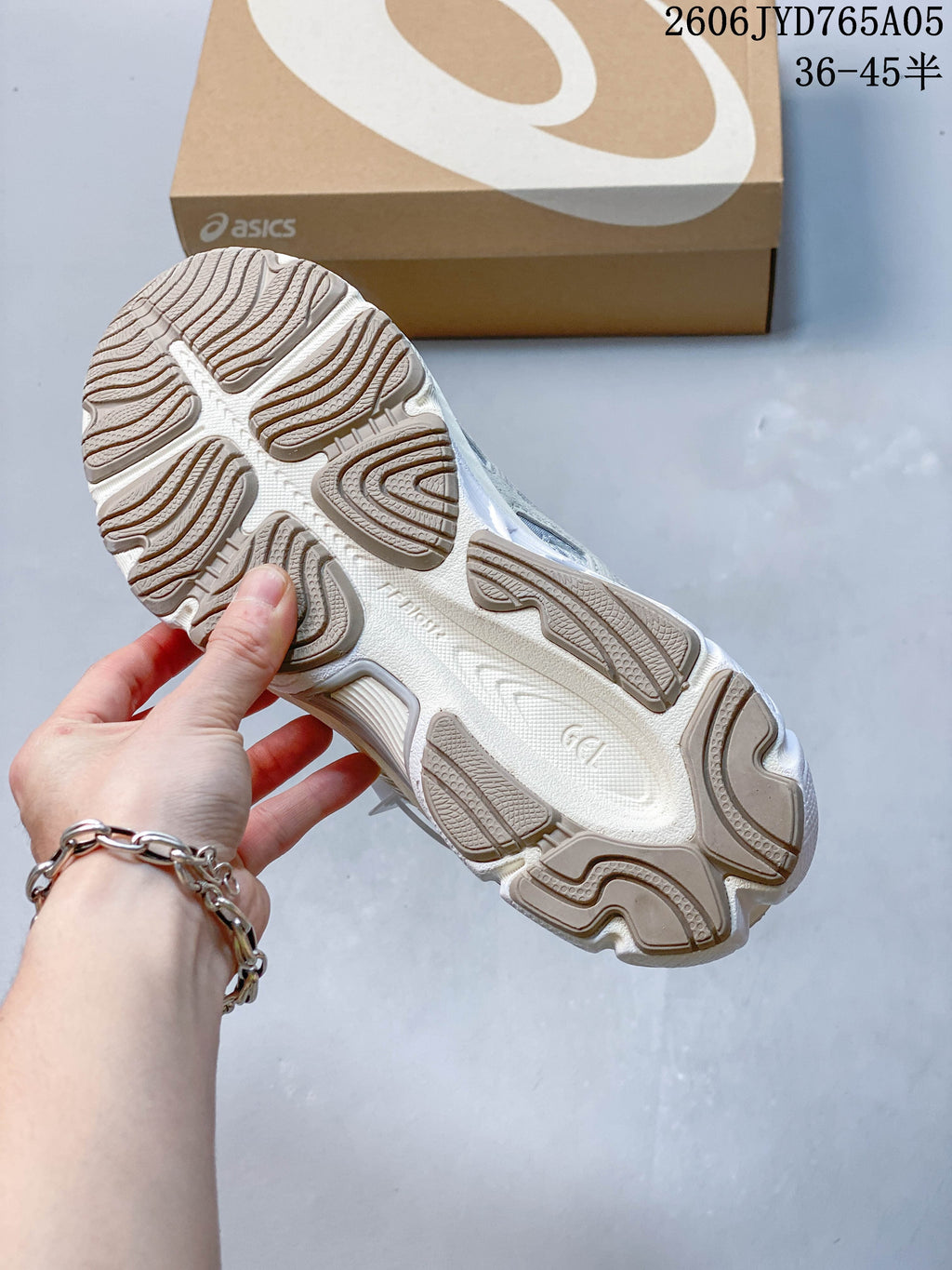 Underside of the sneaker showing a patterned segmented outsole