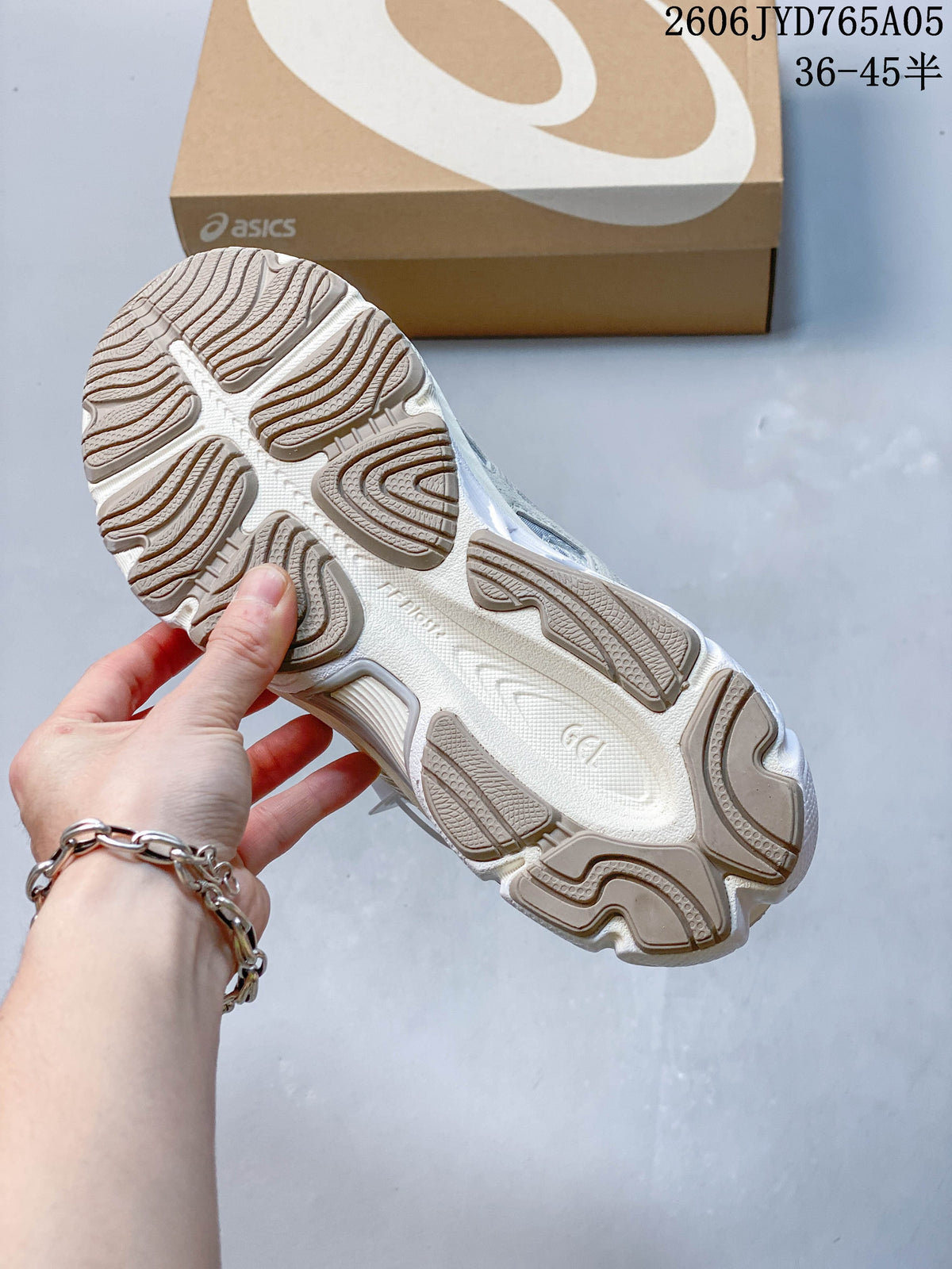 Underside of the sneaker showing a patterned segmented outsole