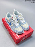 Pair of light blue and white NikeCourt Borough 2 Low sneakers on a red shoebox