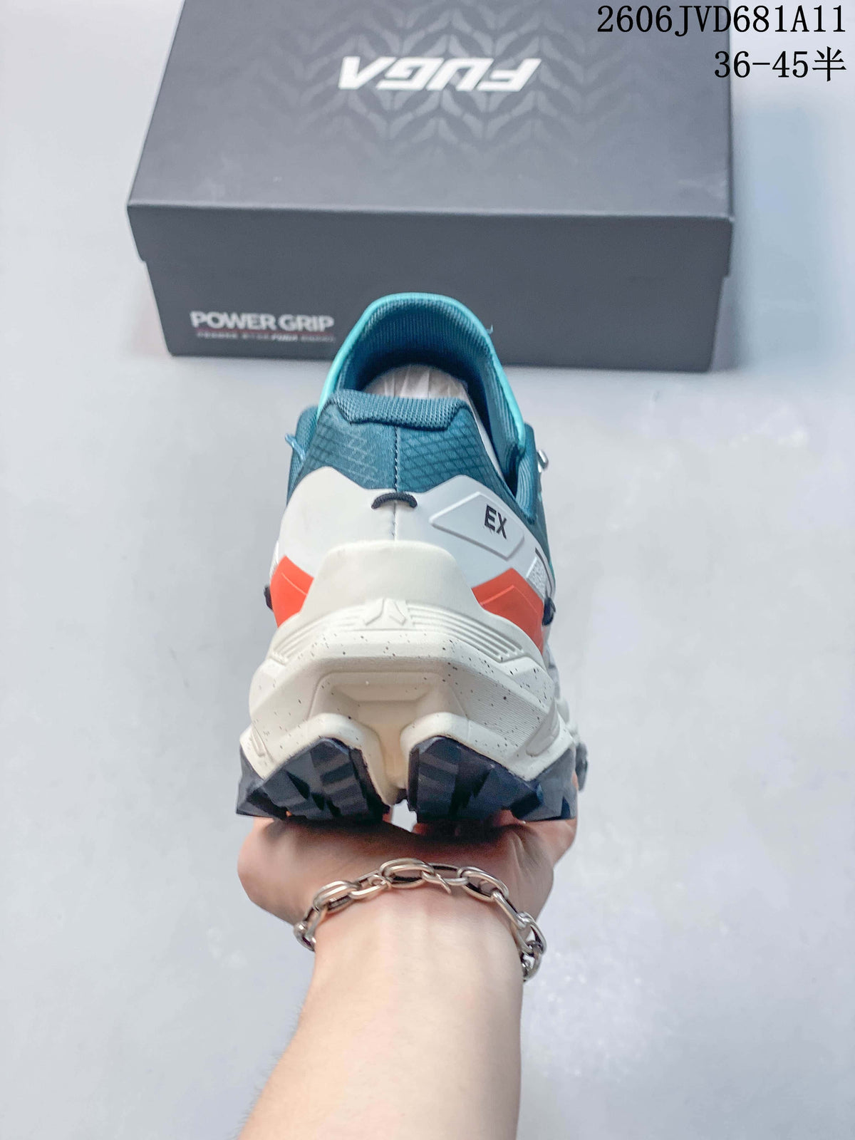 Rear view showing the shoe heel, white midsole, and orange accent.