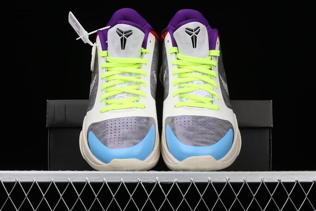 Front view of the pair showing neon laces and blue toe accents
